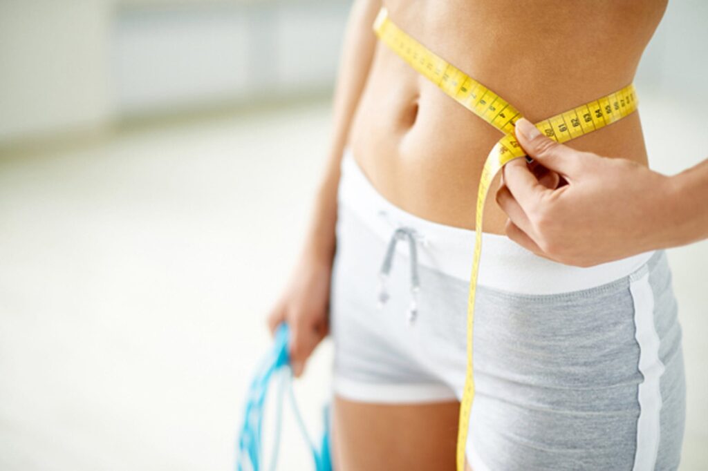 Ernährungsprogramm VitalyseSlim - schlanke Taille einer Frau